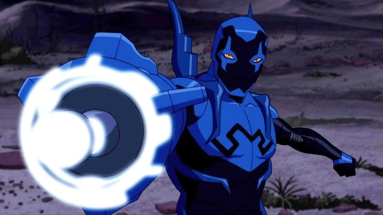 Blue Beetle se prépare à tirer son canon à énergie 