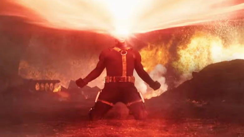 Cyclope tirant une explosion optique sur ses genoux