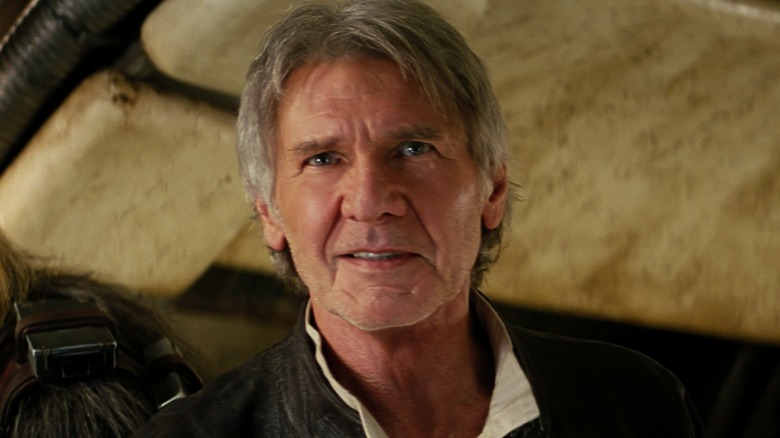 Han Solo souriant après être entré dans le Faucon Millenium 