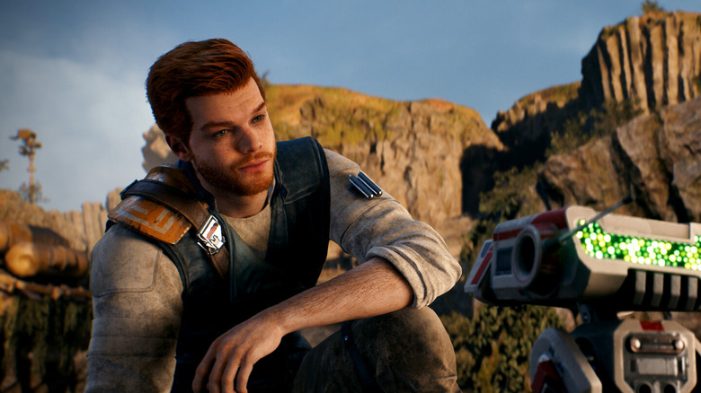 Cal agenouillé et regardant un droïde dans Star Wars Jedi : Survivor (2023)