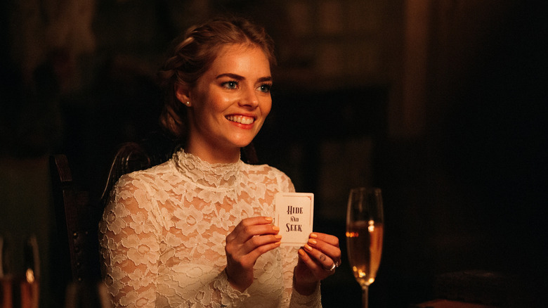 Grace pioche une carte