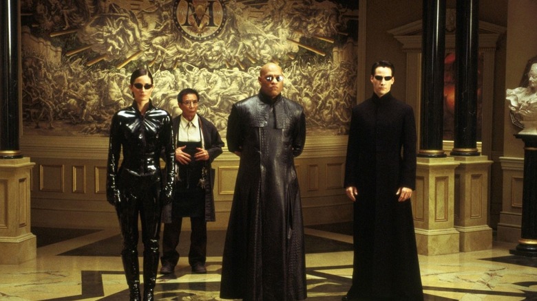 Neo, Morpheus et Trinity rendent visite au Mérovingien dans 