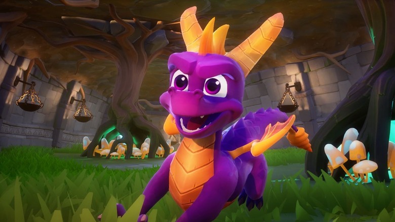 Spyro chargeant à travers un monde herbeux dans 