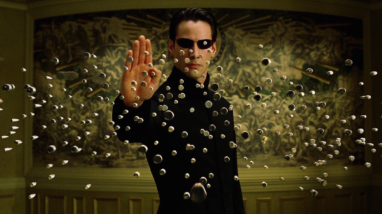 Neo arrête une pluie de balles dans