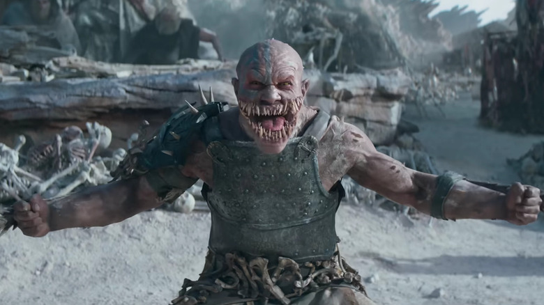 Baraka hurlant et dégainant les lames de son avant-bras 
