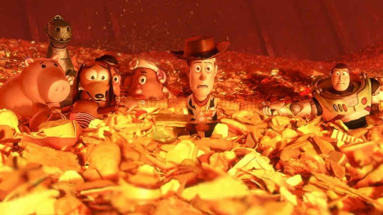 Les jouets se tiennent la main dans l'incinérateur 