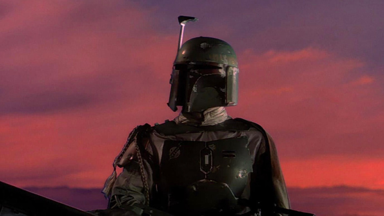 Boba Fett regardant vers la gauche face au magnifique coucher de soleil de Bespin dans L'Empire contre-attaque (1980)
