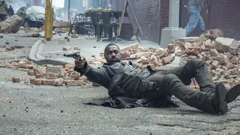 Le Gunslinger au sol, pointant son arme vers 