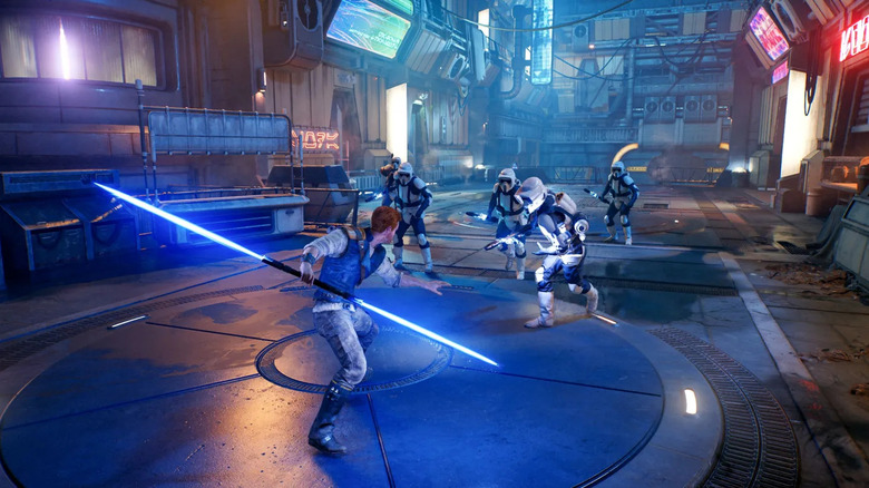 Cal Kestis brandissant un sabre laser bleu à double lame contre une escouade de Scout Troopers dans Star Wars Jedi : Survivor (2023)