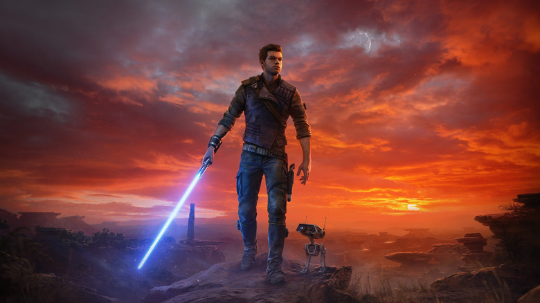 Cal Kestis et BD-1 debout devant un magnifique coucher de soleil, sabre laser bleu sorti, sur la couverture de Star Wars Jedi : Survivor (2023)
