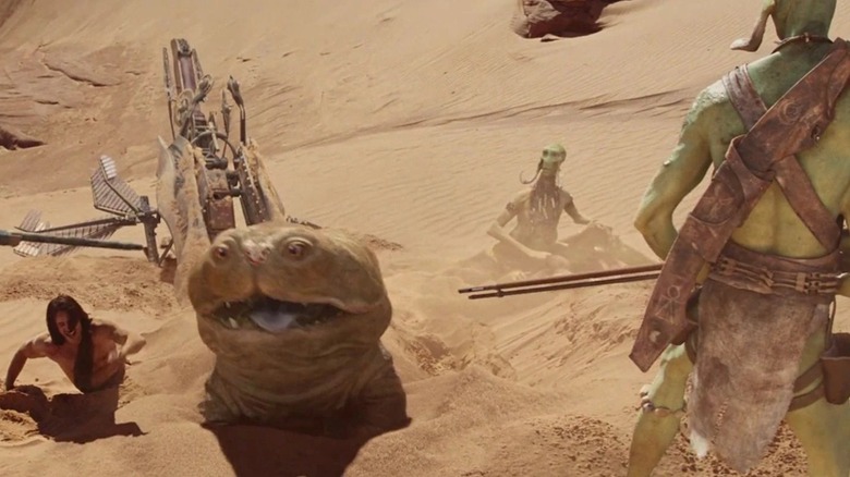 John Carter et Woola entourés de guerriers Thark dans John Carter (2012)