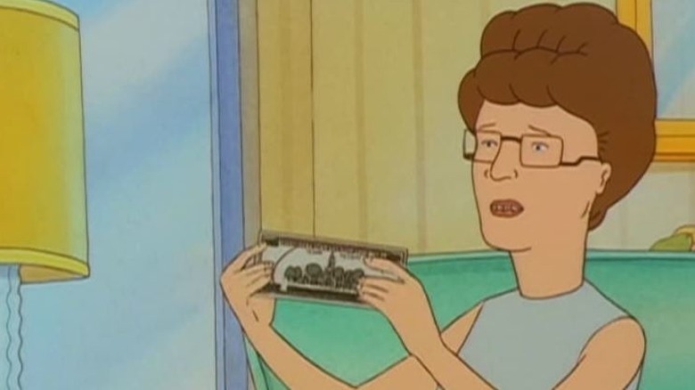 Peggy Hill détient de l'argent