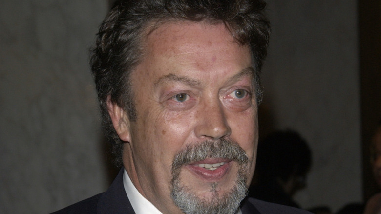 Tim Curry souriant à l'avant-première du film