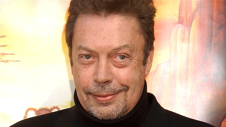 Tim Curry souriant à l'avant-première du film