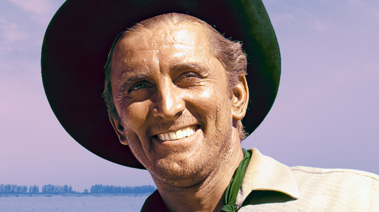 Kirk Douglas porte un chapeau de cowboy et transpire
