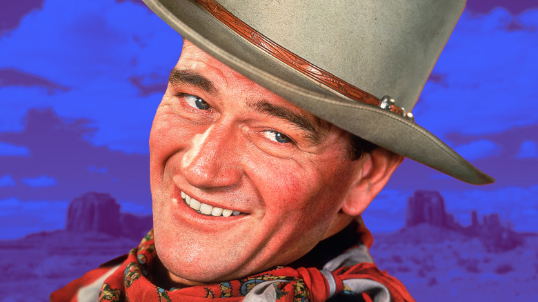 John Wayne souriant et portant un chapeau de cowboy