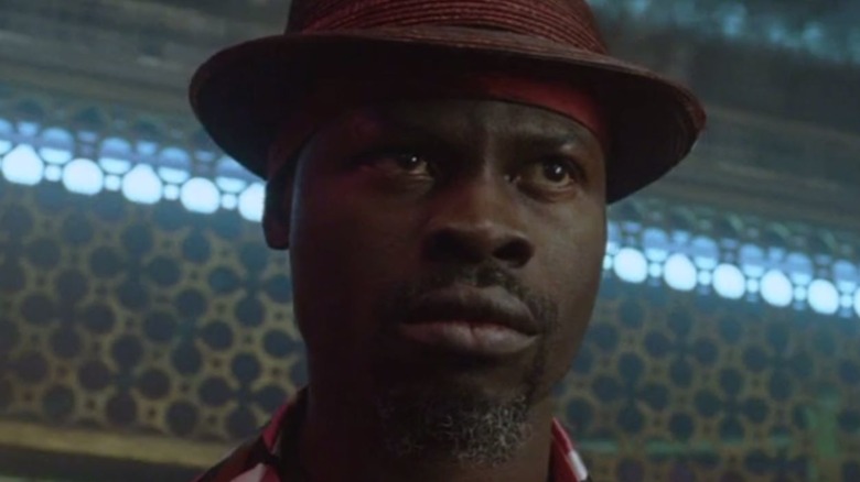 Papa Midnite de Constantine dans un chapeau trilby